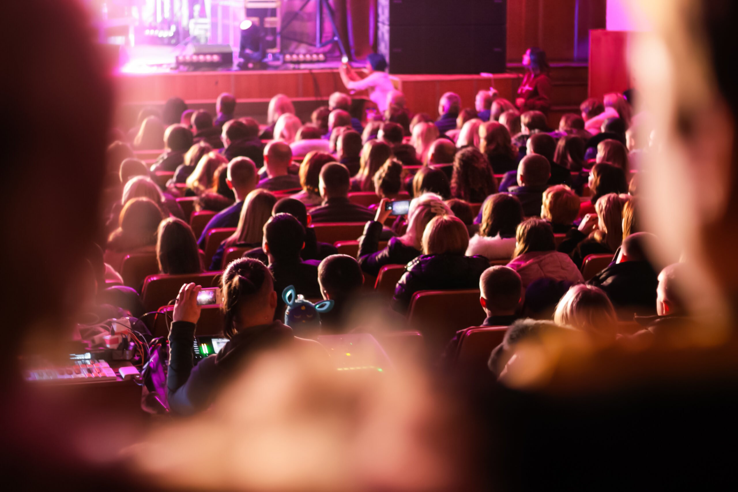 A seated audience attending a live event